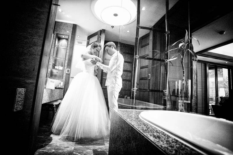 Koh Lipe elopement photography, bride and the groom getting ready in their room before a walk down the aisle to the beach wedding ceremony.
